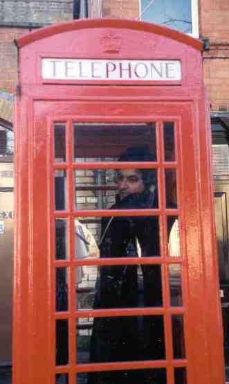 [Photo of MadAlfred in London phone booth 11/2000]